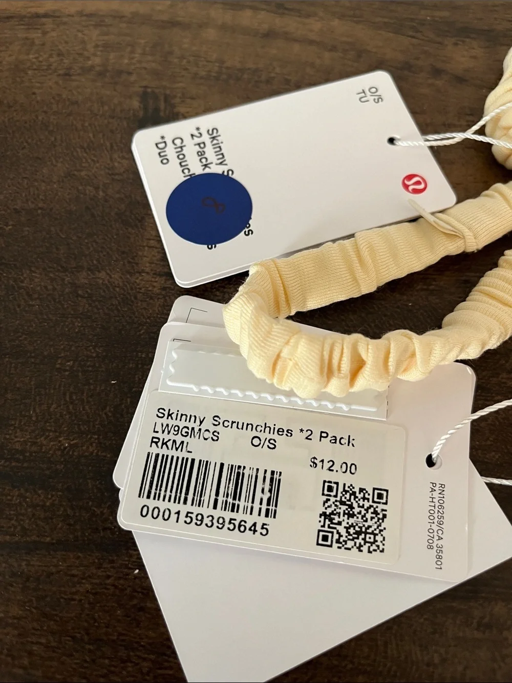 lululemon athletica Skinny Scrunchie Lot in melon and a cream color